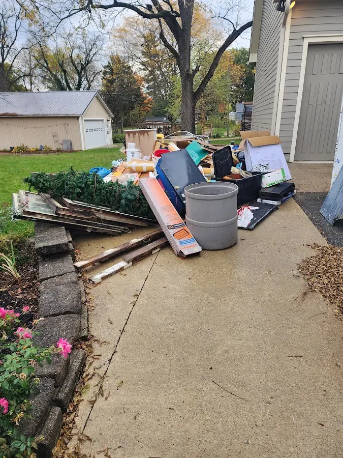 Dumpster being loaded with debris for Commercial Dumpster Rental in Cary